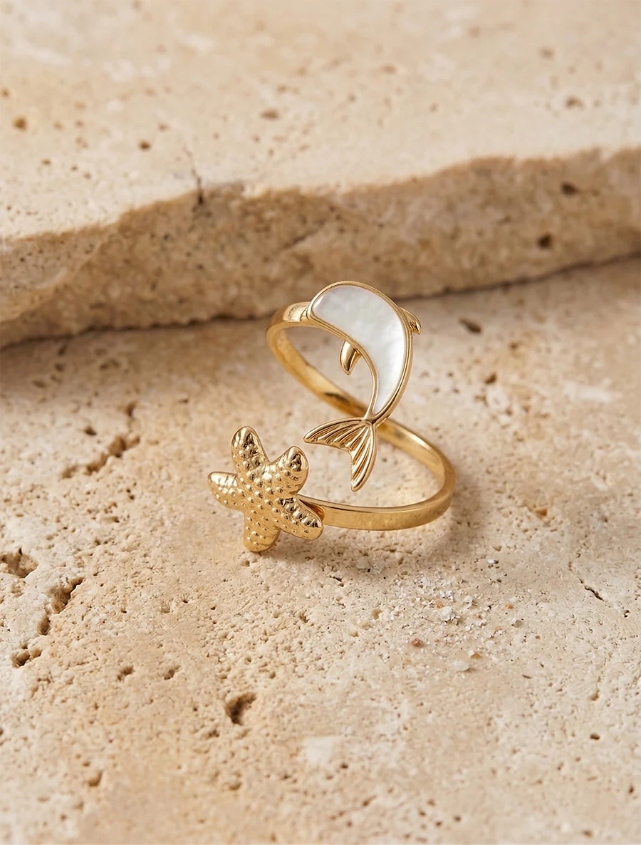 Bague motif dauphin et étoile de mer - Or