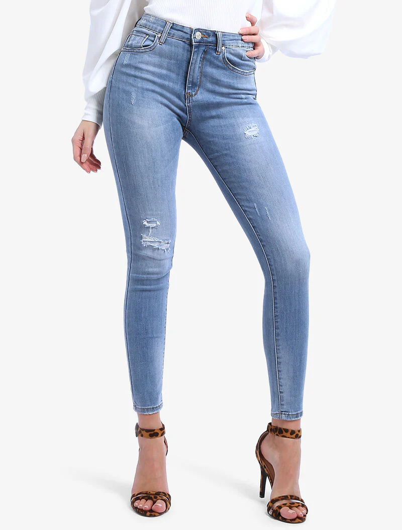 Jean effet usé et griffé - denim clair